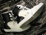 A Pair of Black and White Chuck Taylor Converses